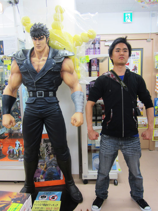 posing next to some game character